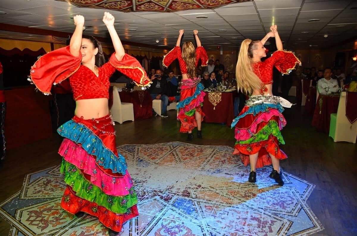 Folk dancers performing on a dinner cruise