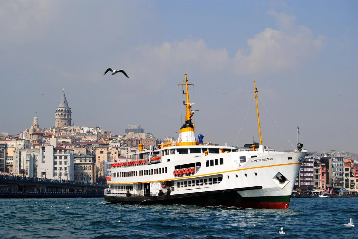 Ahmet H. Yildirim passenger ferry on the Bosphorus with Galata Tower behind it
