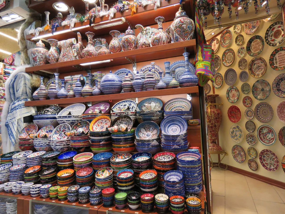 Colourful ceramic bowls, plates and vases displayed inside the Grand Bazaar