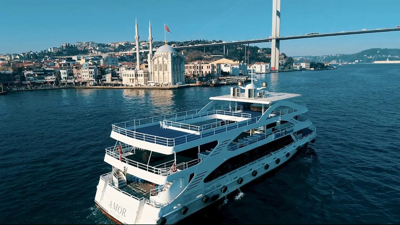 Yacht passing Ortaköy Mosque