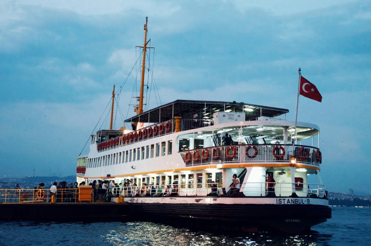 The Istanbul-9 passenger ferry beside a pier at dusk