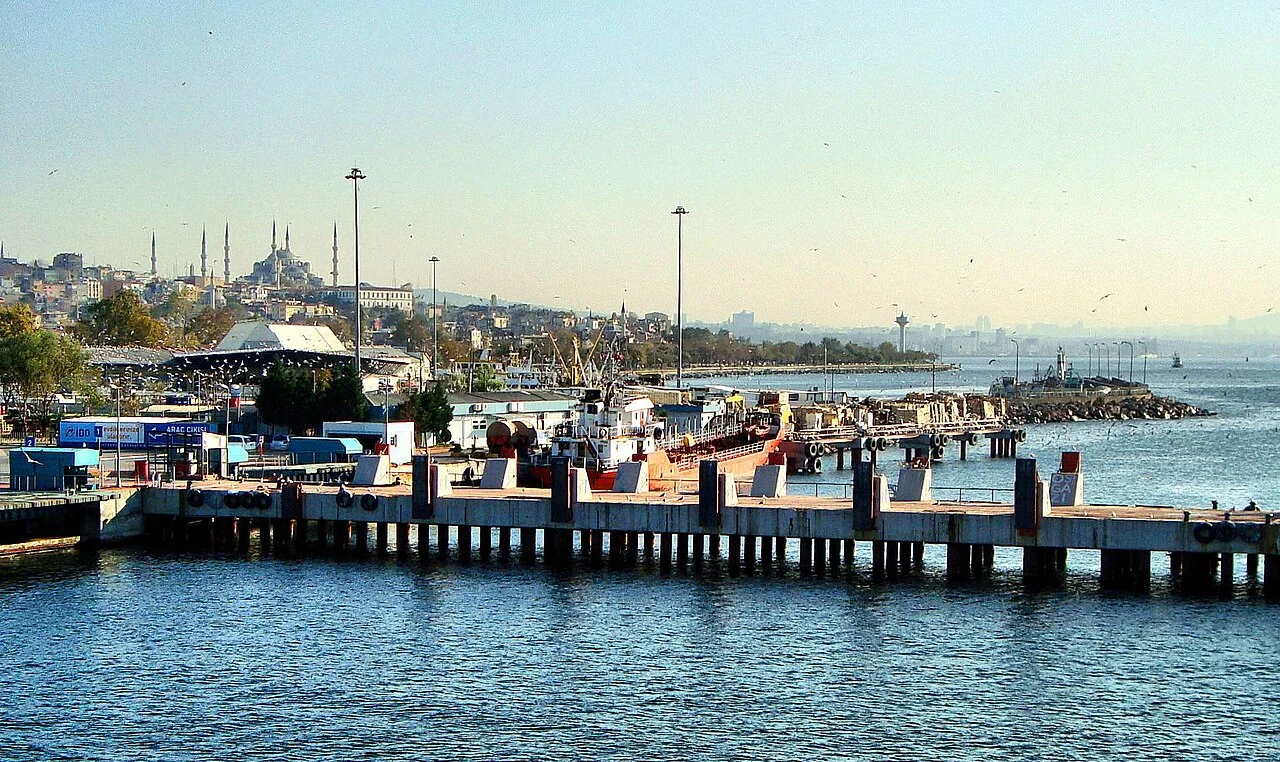 People beside the water and pier on the Yenikapı waterfront